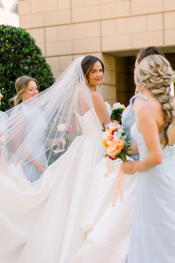Bride and bridesmaids in blue dresses
