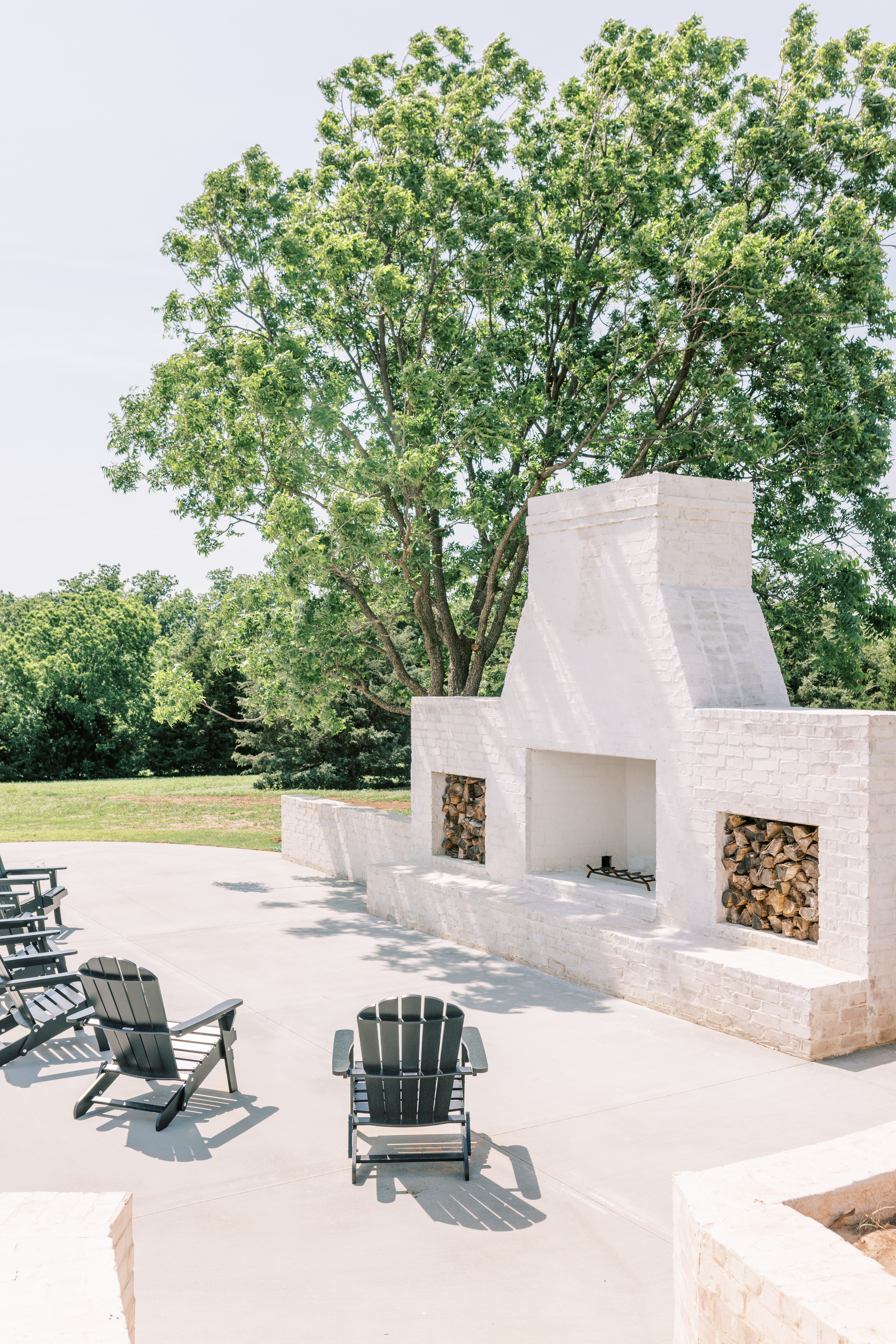 White brick outdoor fireplace at local wedding venue in Oklahoma