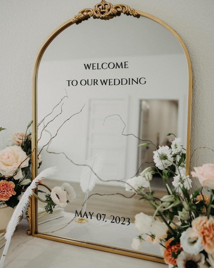 gold mirror welcome sign wedding
