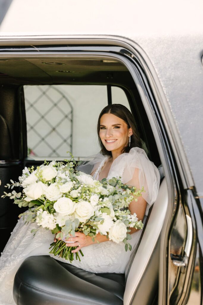 bride in limo on wedding day